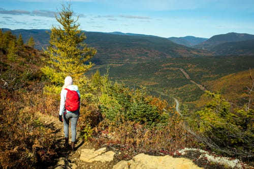 hiker-explores-a-scenic-mountain-trail-during-autumn